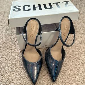 Schutz brand slip in mules. Sparkle!